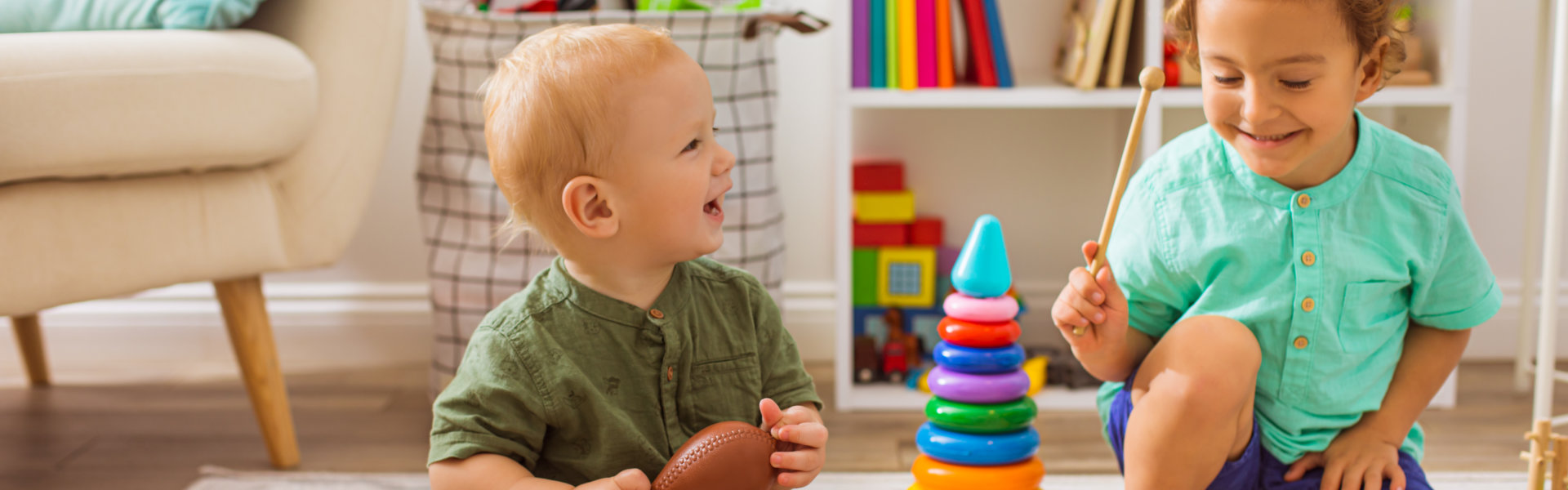 The little boys play with musical toys in kindergarten